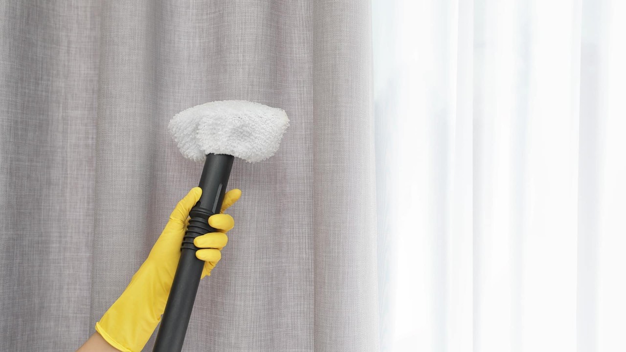 Image of a person steaming fabric window treatment near Tacoma, Washington (WA)