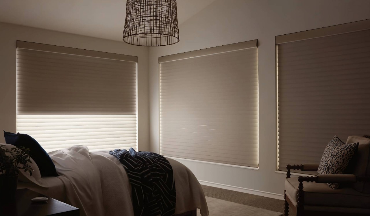 Hunter Douglas Silhouette® Sheer Shades with room-darkening enhancements on windows in a neutral-themed bedroom at Smart PNW near Tacoma, WA